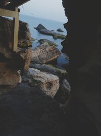 High angle view of rocks on beach against sky