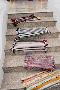 High angle view of multi colored doormat on stairs