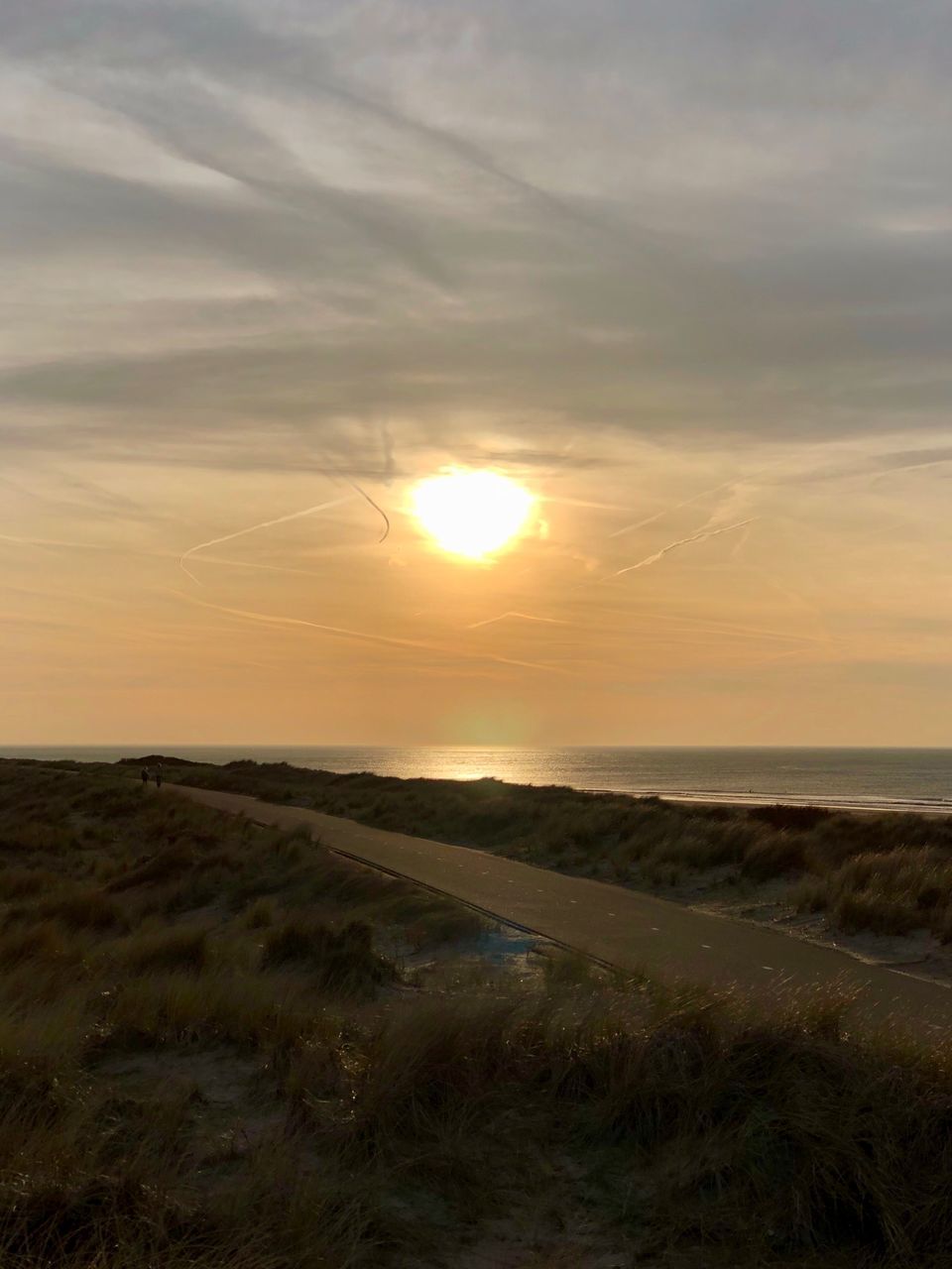 SCENIC VIEW OF SUNSET OVER SEA