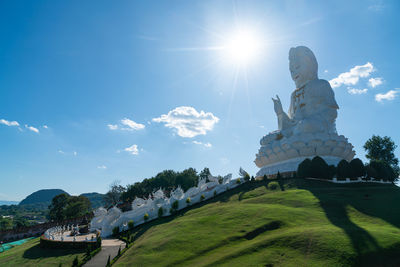 Low angle view of statue against sky