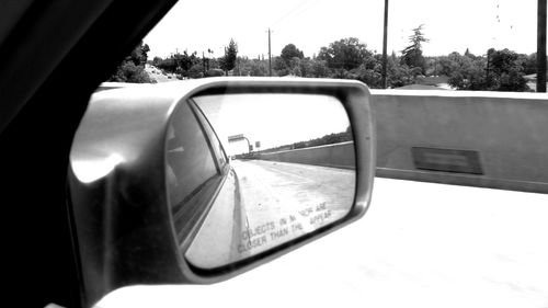 Cropped image of car on road