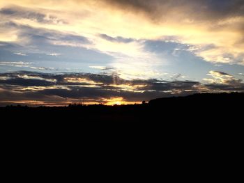 Scenic view of silhouette landscape against sky during sunset