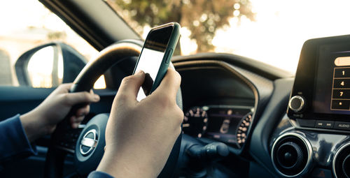 Midsection of woman using mobile phone