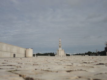 View of building by sea against sky