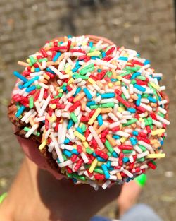 Close-up of cropped hand holding object