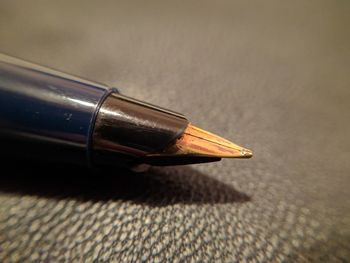 Close-up of pen on table