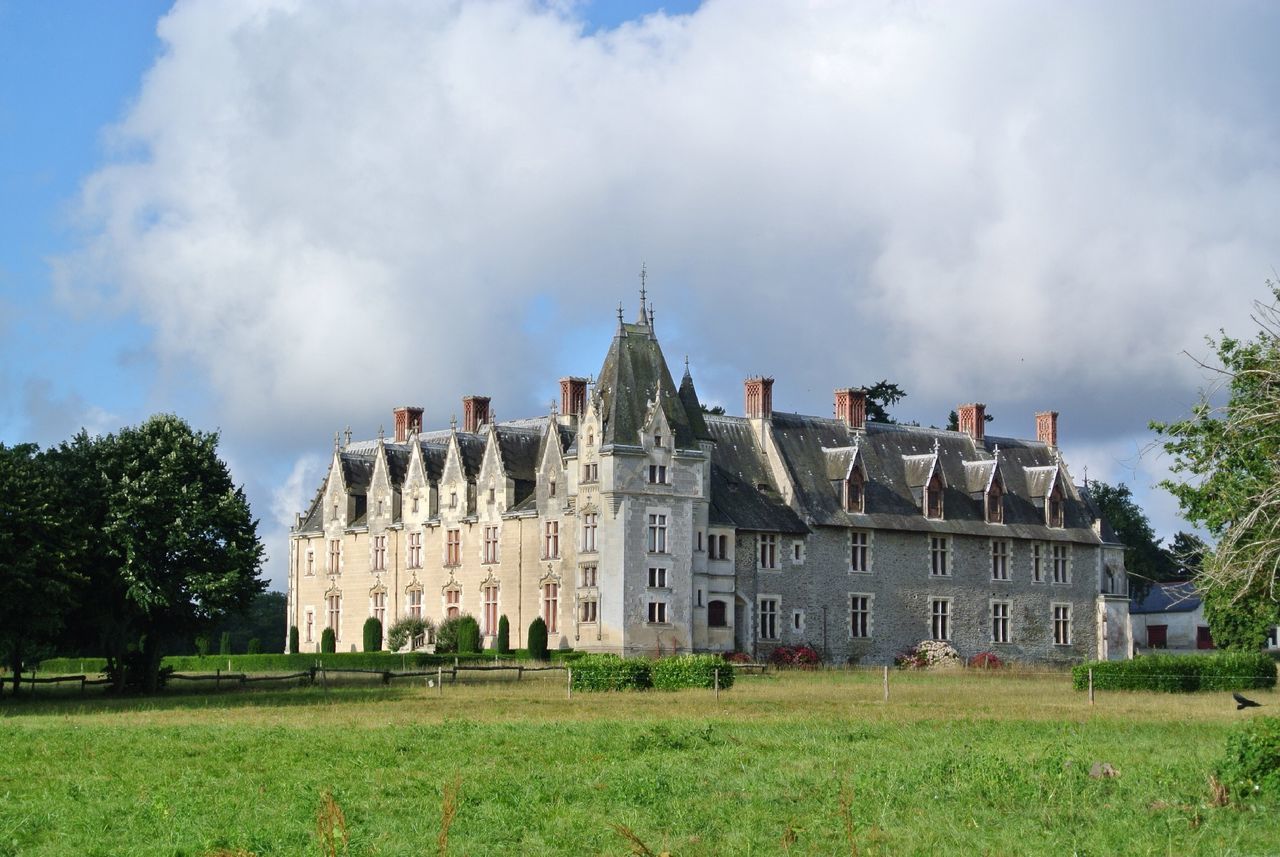 architecture, built structure, building exterior, sky, tree, grass, cloud - sky, cloud, cloudy, green color, day, outdoors, no people, lawn, incidental people, growth, low angle view, nature, travel destinations, field