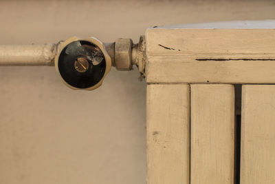 Close-up of pipes against wall