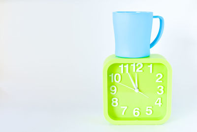 Close-up of clock against white background