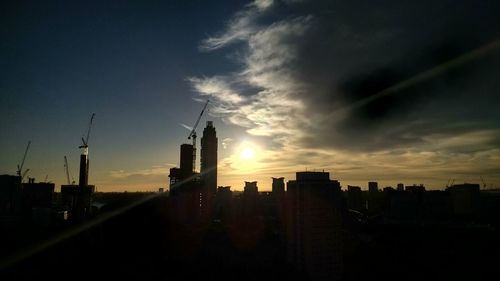 Silhouette of city at sunset