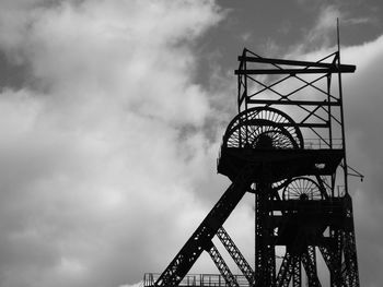 Low angle view of built structure at astley green colliery museum against cloudy sky