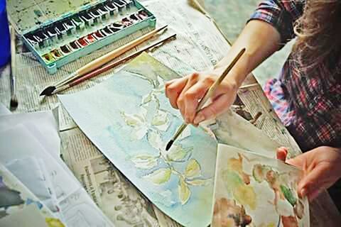 CROPPED IMAGE OF WOMAN WRITING ON BOOK