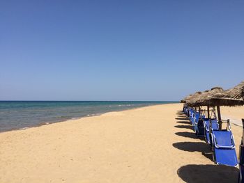 Scenic view of beach against clear sky