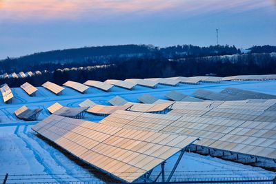 High angle view of solar panels against blue sky