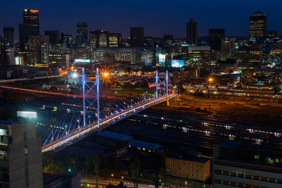 High angle view of illuminated buildings in city at night