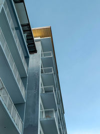 Low angle view of modern building against clear sky