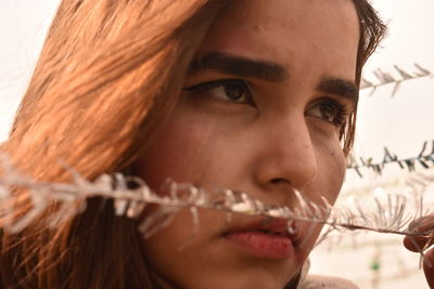 Close-up of young woman with eyes closed