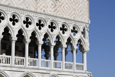 Low angle view of historical building against clear blue sky