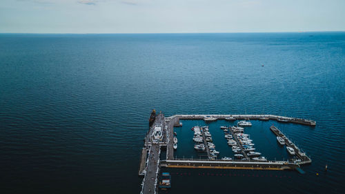 Photo showing the view of the pier with the sea and beautiful sky.