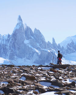 Scenic view of snowcapped mountains against clear sky