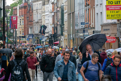 Group of people walking on city street