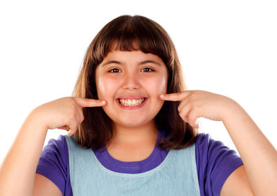 Portrait of a smiling young woman over white background