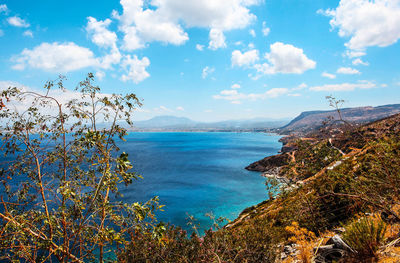 Scenic view of sea against cloudy sky