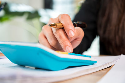 Close-up of woman hand on table