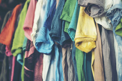 Close-up of clothes hanging at market stall