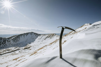 Mountaineering ice ax on snow slope near summit of wheeler peak, nm