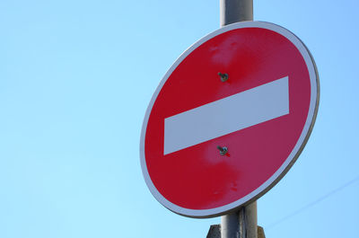 Low angle view do not enter sign against sky