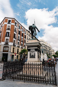 Statue of historic building against sky