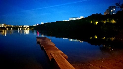 Scenic view of river against sky at night
