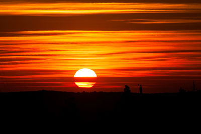 Scenic view of silhouette land against sky during sunset