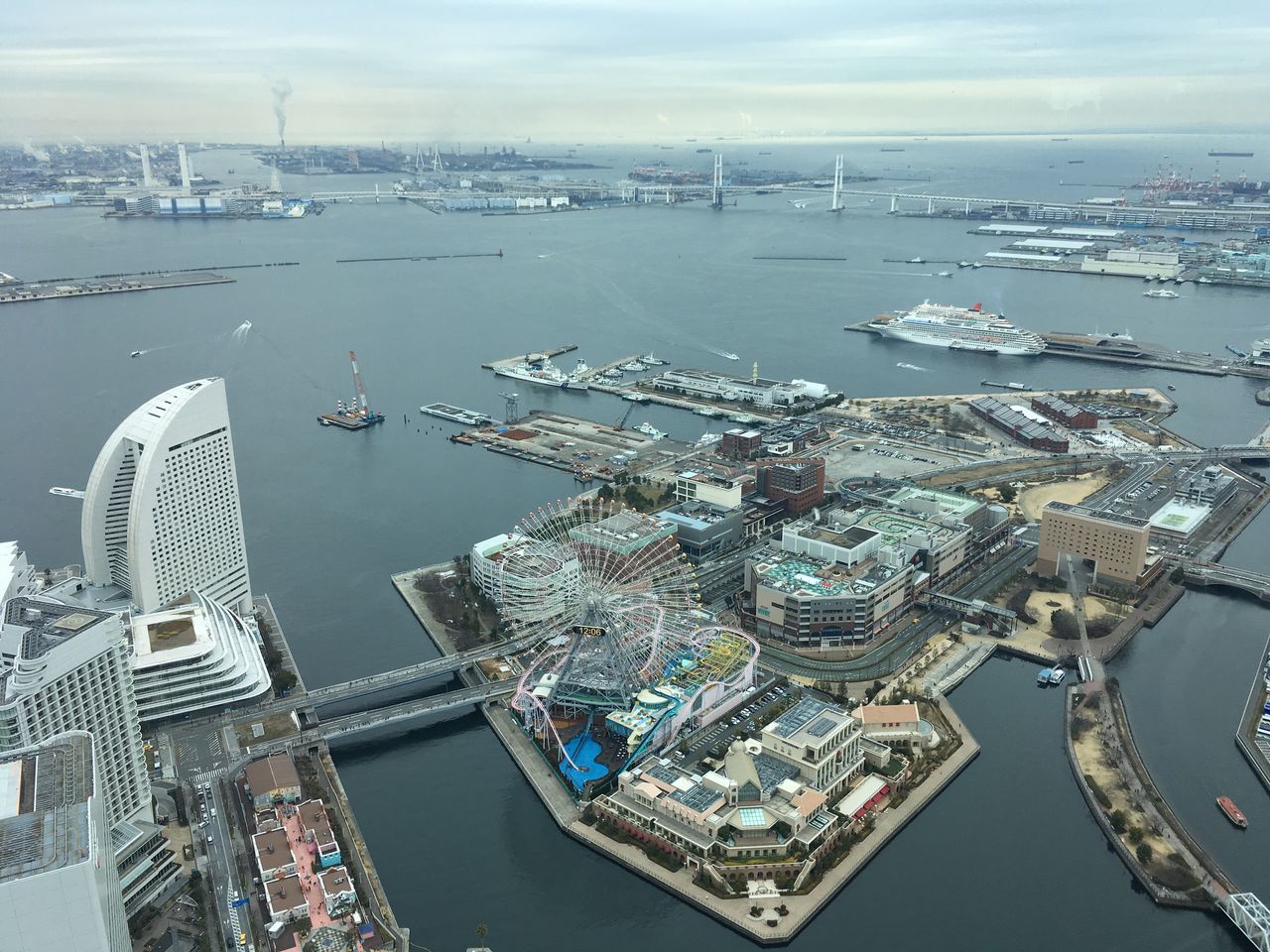 water, building exterior, city, high angle view, transportation, nautical vessel, built structure, architecture, sea, cityscape, harbor, aerial view, no people, nature, travel destinations, mode of transportation, day, sky, commercial dock, outdoors, office building exterior, skyscraper