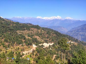 High angle view of trees and mountains against sky