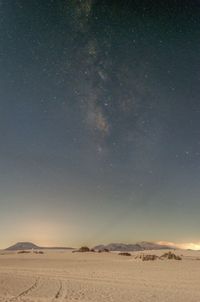 Scenic view of desert against sky at night