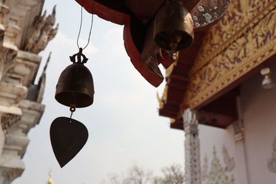 Low angle view of lanterns hanging outside building