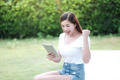 Young woman using mobile phone