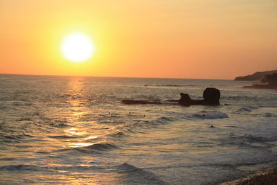 Scenic view of sea against sky during sunset