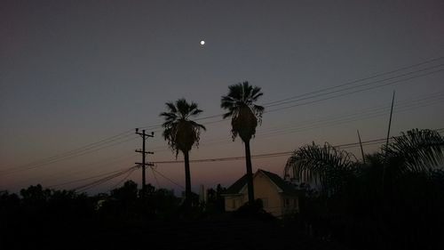 Low angle view of built structure at sunset