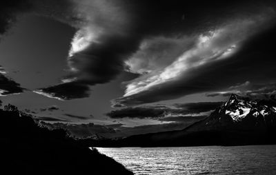 Scenic view of mountains against cloudy sky