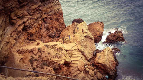 High angle view of rock formation in sea