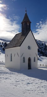 Building against sky during winter