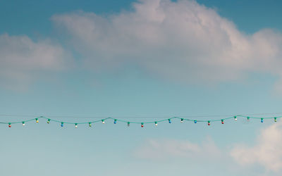 Light garland on blue sky