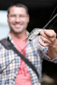 Happy fisher shows catch