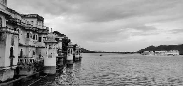 Panoramic view of sea and buildings against sky