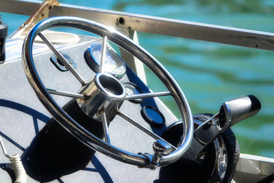 Close-up of wheel by sea