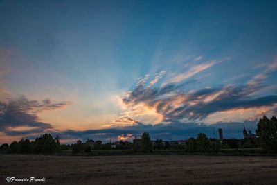 Scenic view of landscape against sky during sunset