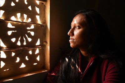 Close-up portrait of woman looking away